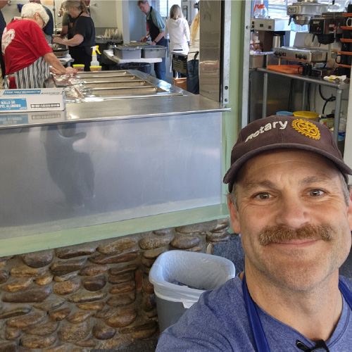 Asheville Metro Rotary Club Serving Food